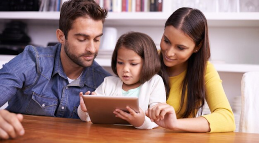 Parents viewing their child's academic progress on a mobile device